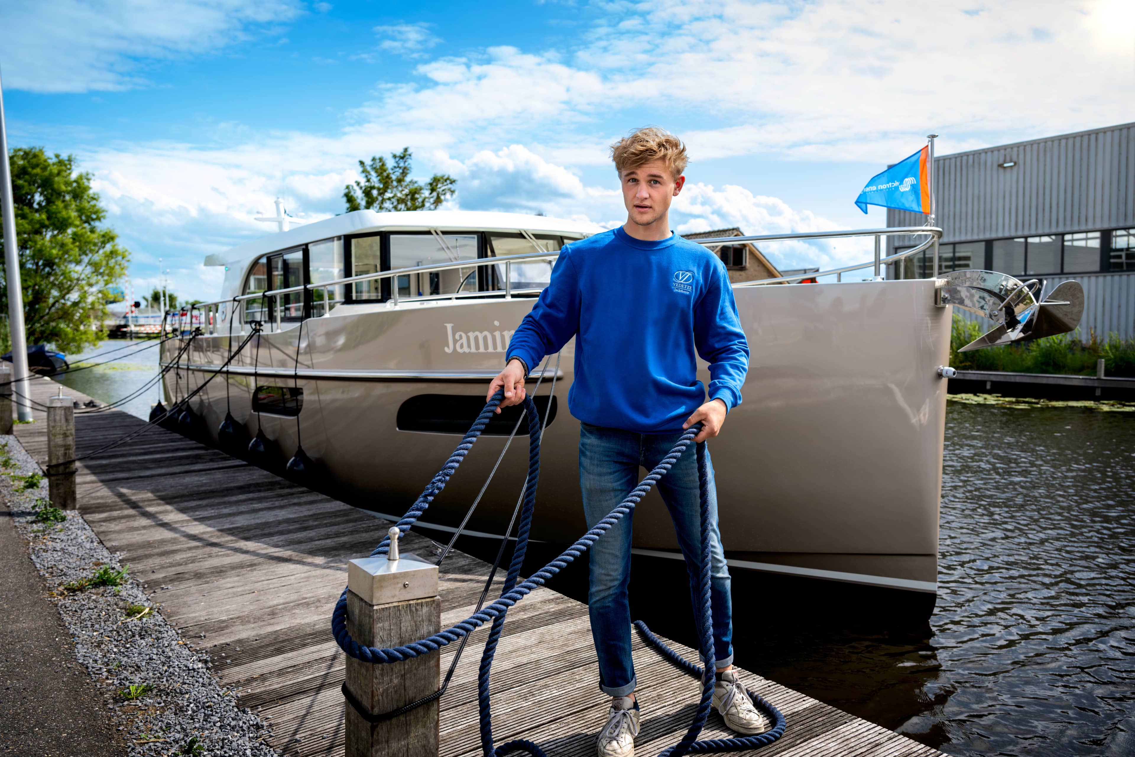 Person standing in front of a boat